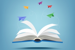 Open book with colorful paper planes emerging from the pages