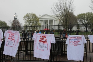 White T-shirts hang on a clothesline near the White House as part of a Title IX awareness campaign.