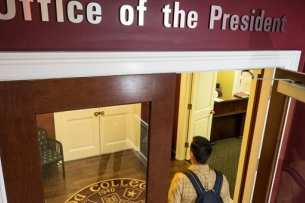Student entering a president's office