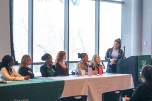 A group of women students speaking on a panel at Manhattan College.