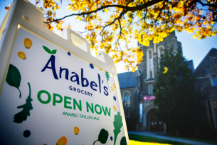 An A frame sign on Cornell's campus reads, "Anabel's Grocery Open Now"