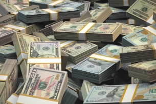 Stacks of one-hundred-dollar bills piled on top of one another
