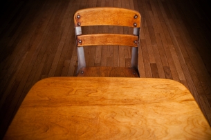 Empty Old School Desk on Hardwood Floor