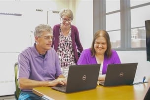 Faculty members receive support in the accessibility lab at the University of North Dakota