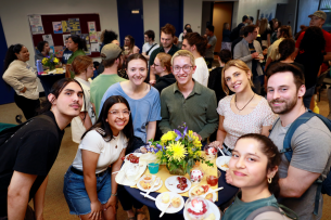 Oregon Tech students smile for a photo at a dessert reception.