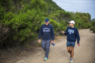 President James T. Harris walked with student in a canyon near the University of San Diego