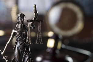 A photo illustration of the scales of justice