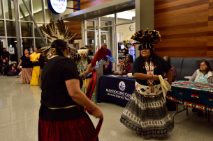 Two Pomo dancers wear traditional regalia at Mendocino College's Native American Day.