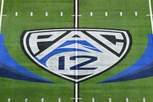 Pac-12 logo at midfield of a football field