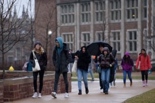 Students walk on campus at Washington University in St. Louis