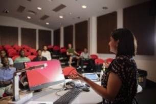 Teacher leading a class with digital technology