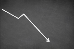A white line graph against a black background depicting a sharply downward trend.
