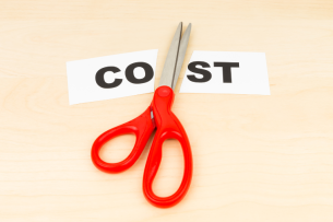 A pair of scissors lying atop a piece of paper, cut in half, with the word "COST."