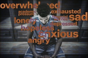 A student athlete in a blue jersey sits surrounded by words like "overwhelmed," "angry" and "financial worries," indicating he is feeling stress