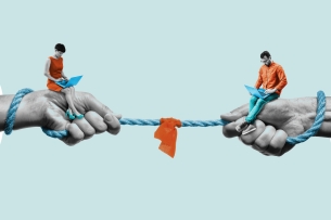 Two large hands are on the left and right side of the photo, each holding a smaller person that is looking at a laptop. There is a rope between the two large hands with an orange cloth in the middle of it.