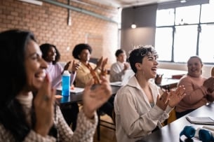 Students clapping in the classroom