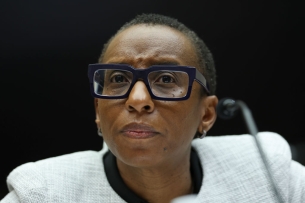 Claudine Gay, a Black woman with short, dark hair wearing thick-framed black glasses, testified before Congress Dec. 5, 2023.