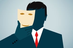 Man in suit hides his face behind a mask