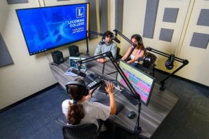 Students in a podcast studio