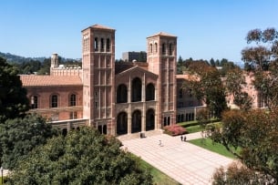 A brick building on a campus green