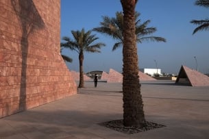 Palm trees and structures in the desert