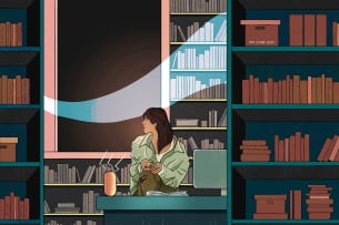 Woman sits at desk surrounded by books and looks searchingly out window from which a ghostly image floats
