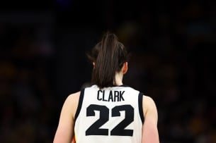 A photo of the back of Caitlin Clark wearing her University of Iowa basketball jersey