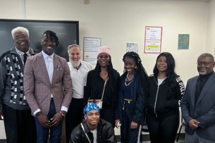 Students at South Carolina State University stand smiling with Meir Muller and Devin Randolph.