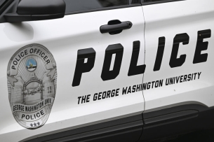 A photo of a police car reading "police—the George Washington University" on its side