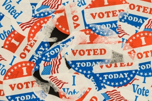Photo of many ripped and tattered "I voted today" stickers.
