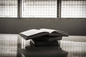 Books in a prison cell