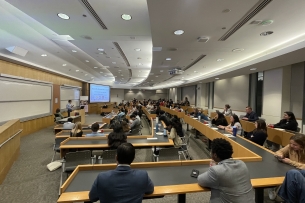 Students sit in lecture hall for constructive dialogue event