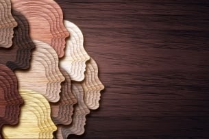 An abstract-style illustration featuring a collage of faceless heads representing people of a wide variety of races.