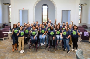 Faculty and staff at the University of Notre Dame wear their first-generation T-shirts