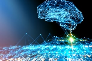An illustration of artificial intelligence as a concept. An AI "brain" is brightly lit and hovers against a black background above a lit-up circuit board. 