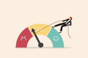 An illustration of a gauge indicating three levels of satisfaction—a red section with a frowning face, a yellow section with a neutral face, and a teal level with a smiling face. The needle points to the low end of the yellow, neutral range. A female standing atop the gauge has lassoed the needle with a rope and appears to be attempting to pull it toward the smiling, positive side of the gauge.