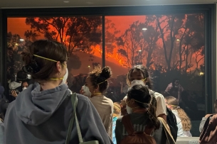 Pepperdine University students wear N-95 masks while watching the Franklin fire creep toward the Malibu campus.