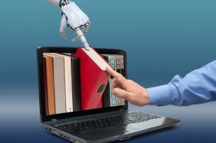 Open laptop with books on screen, human and robot hands touching the book, isolated on a delicate blue gradient background. Concept of deep learning artificial intelligence based on literature.