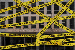 The Education Department building with caution tape on it