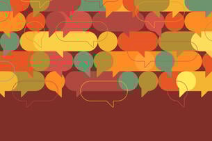 A collection of speech bubbles of many different colors against a brown background.