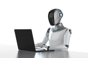An illustration of a robot working at a computer.
