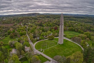 An aerial photo of the Bennington Battle Monument, a 306-foot obelisk.