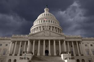 A photo of the U.S. Capitol building against a dark sky. 