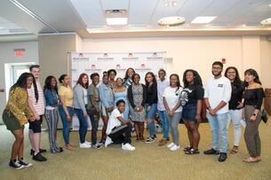 A group of Upward Bound students pose and smile at Montgomery County Community College