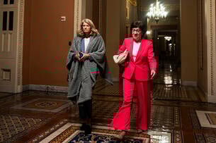 U.S. Sen. Lisa Murkowski (R-AK) and U.S. Sen. Susan Collins (R-ME) walk to the Senate floor during overnight votes at the U.S. Capitol.