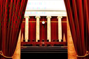 The U.S. Supreme Court, with its red velvet drapes and white columns.