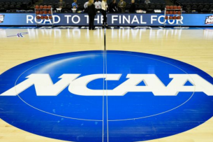 Basketball court with NCAA logo at halfcourt