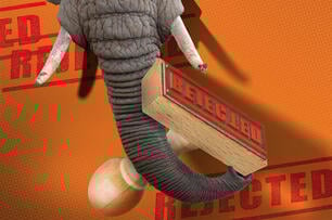An elephant holding a stamp that reads "rejected."