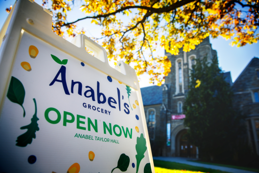 An A frame sign on Cornell's campus reads, "Anabel's Grocery Open Now"