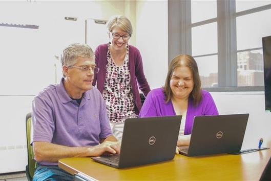 Faculty members receive support in the accessibility lab at the University of North Dakota